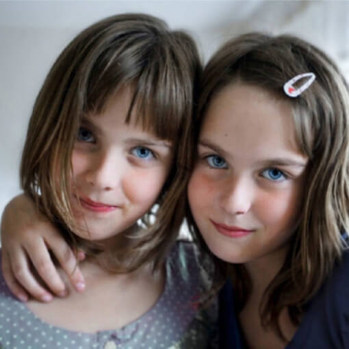 Two young girls posing for the camera